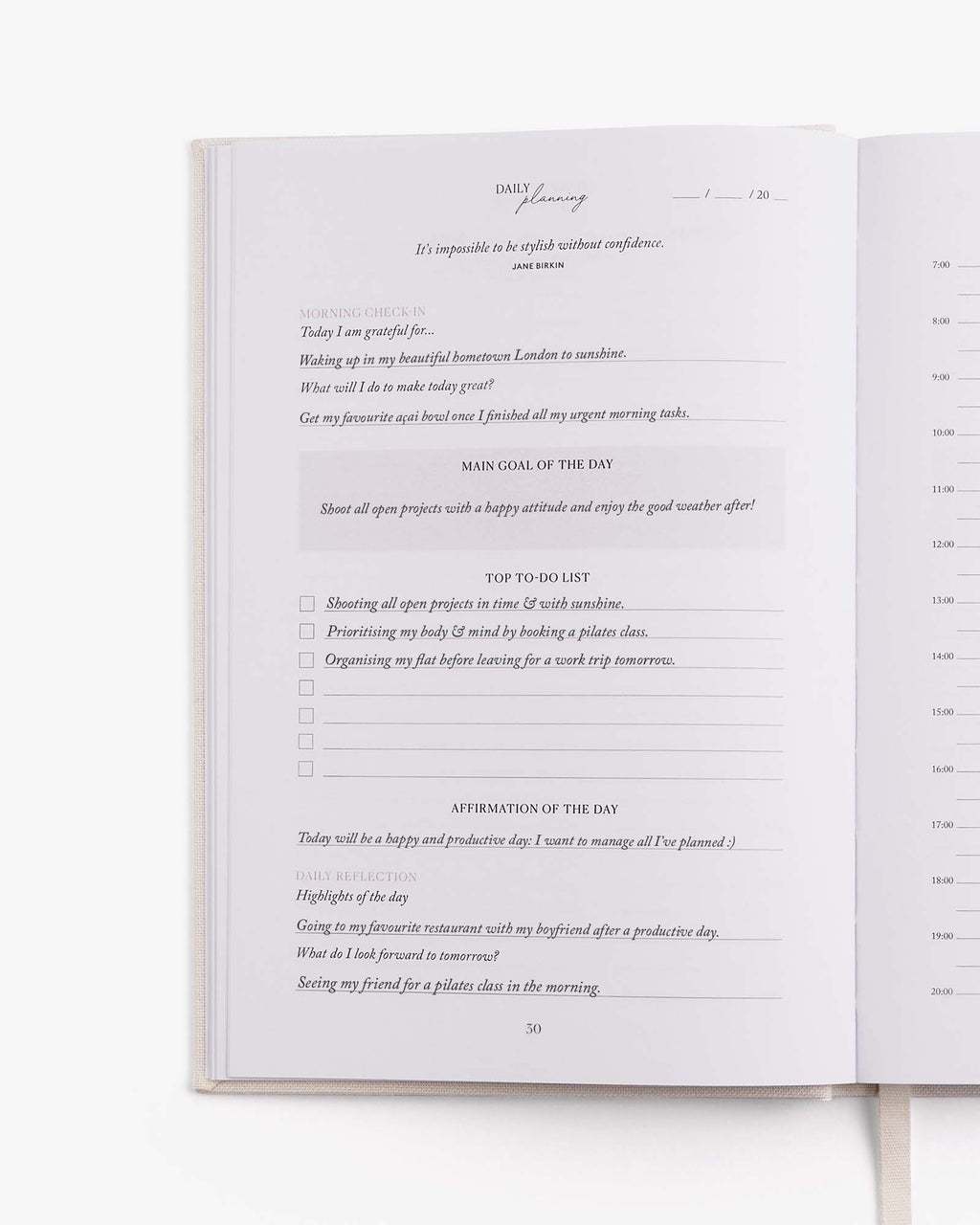 Open book with a daily journal entry on a white background