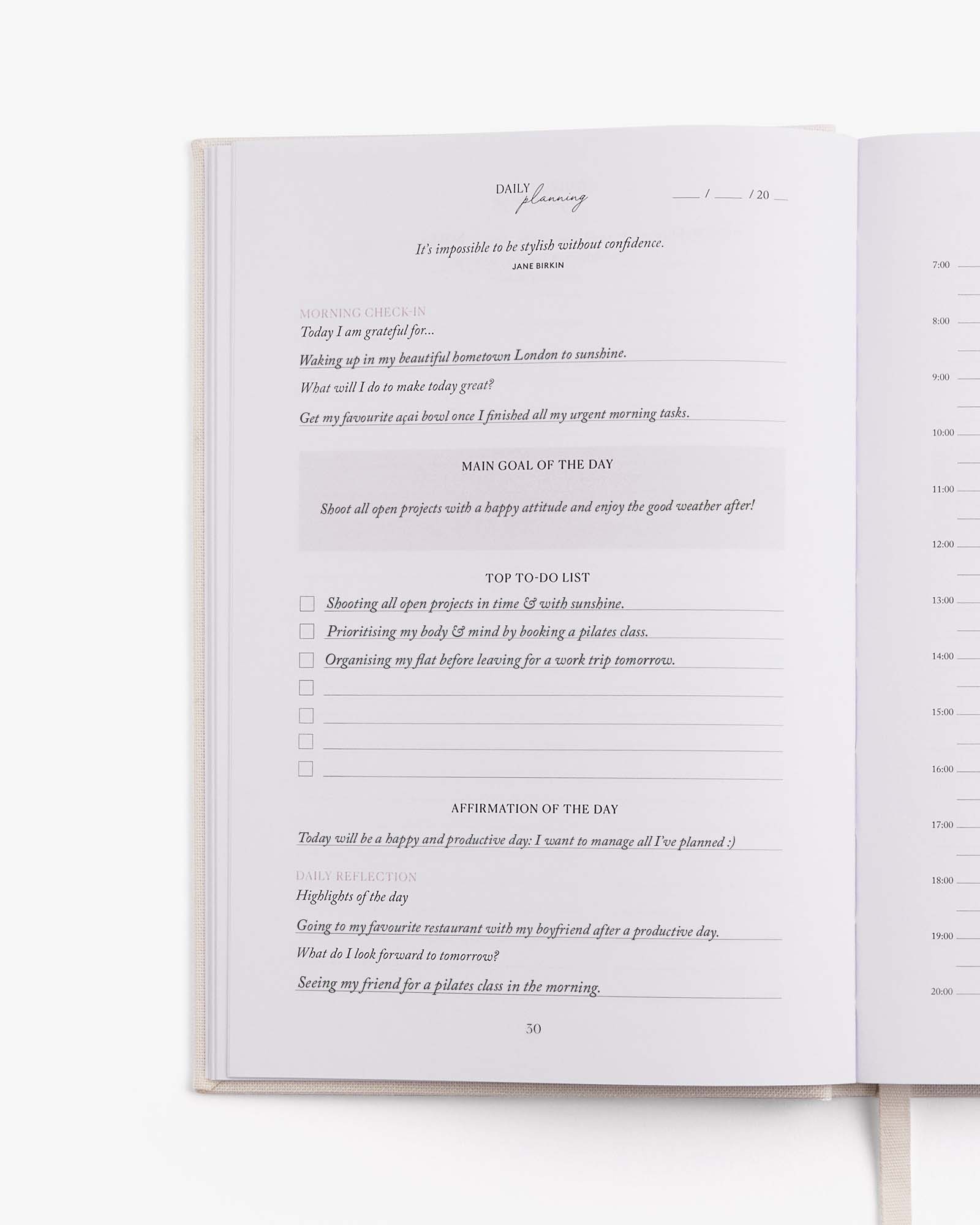 Open book with a daily journal entry on a white background