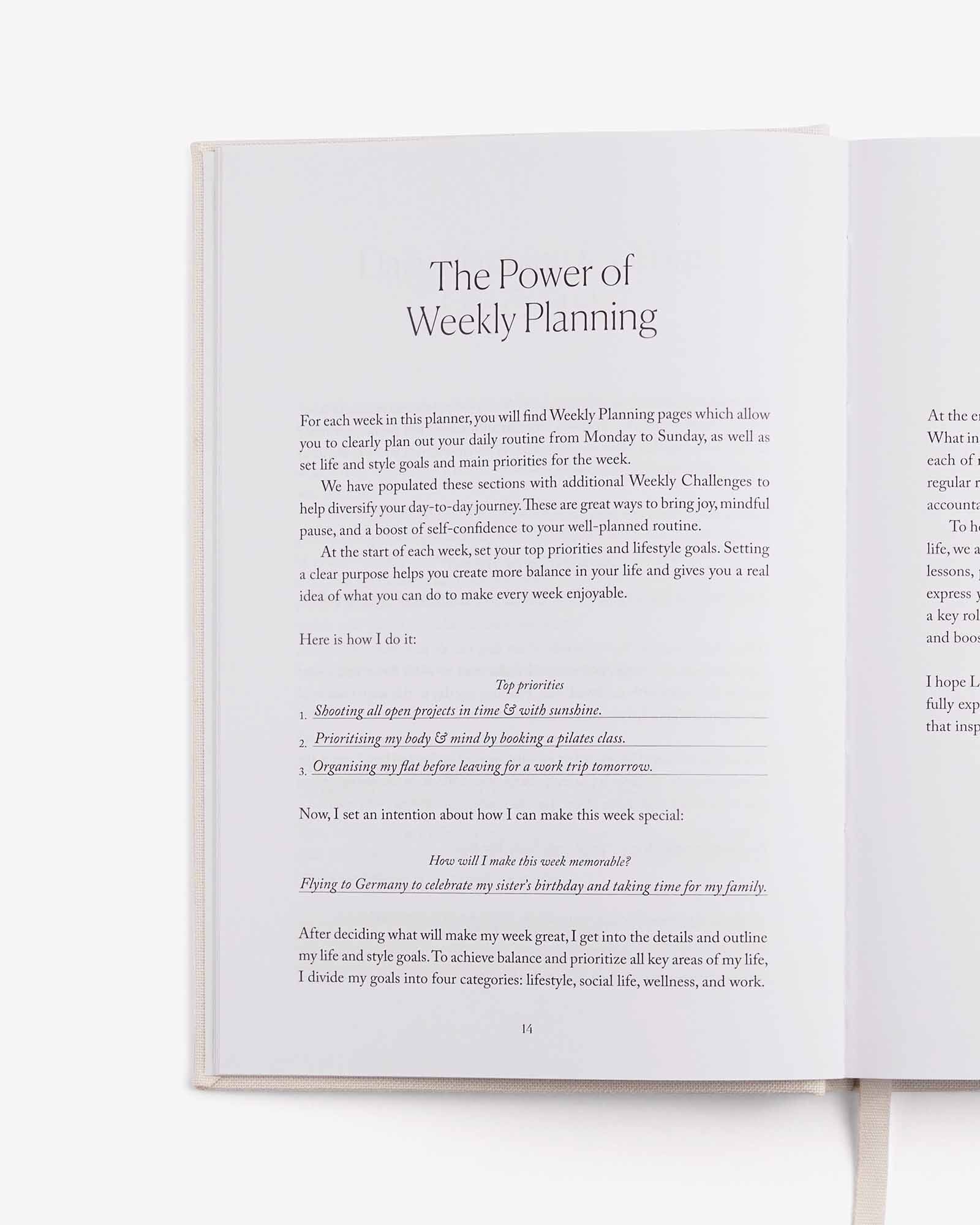 Open book showing text on weekly planning and goal setting.
