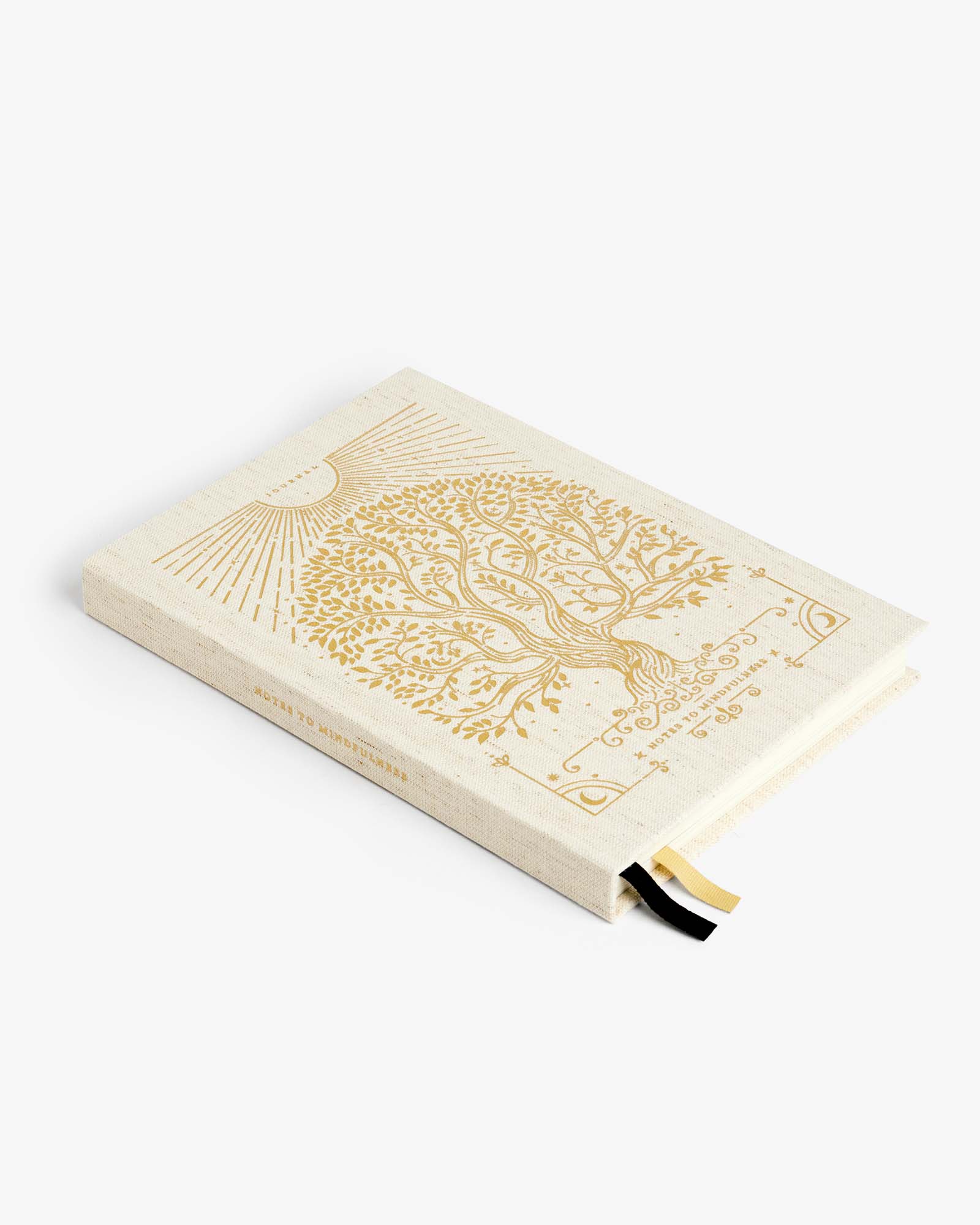 Beige notebook with gold tree design on a white background