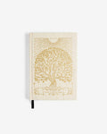 Beige notebook with embossed tree design on a white background