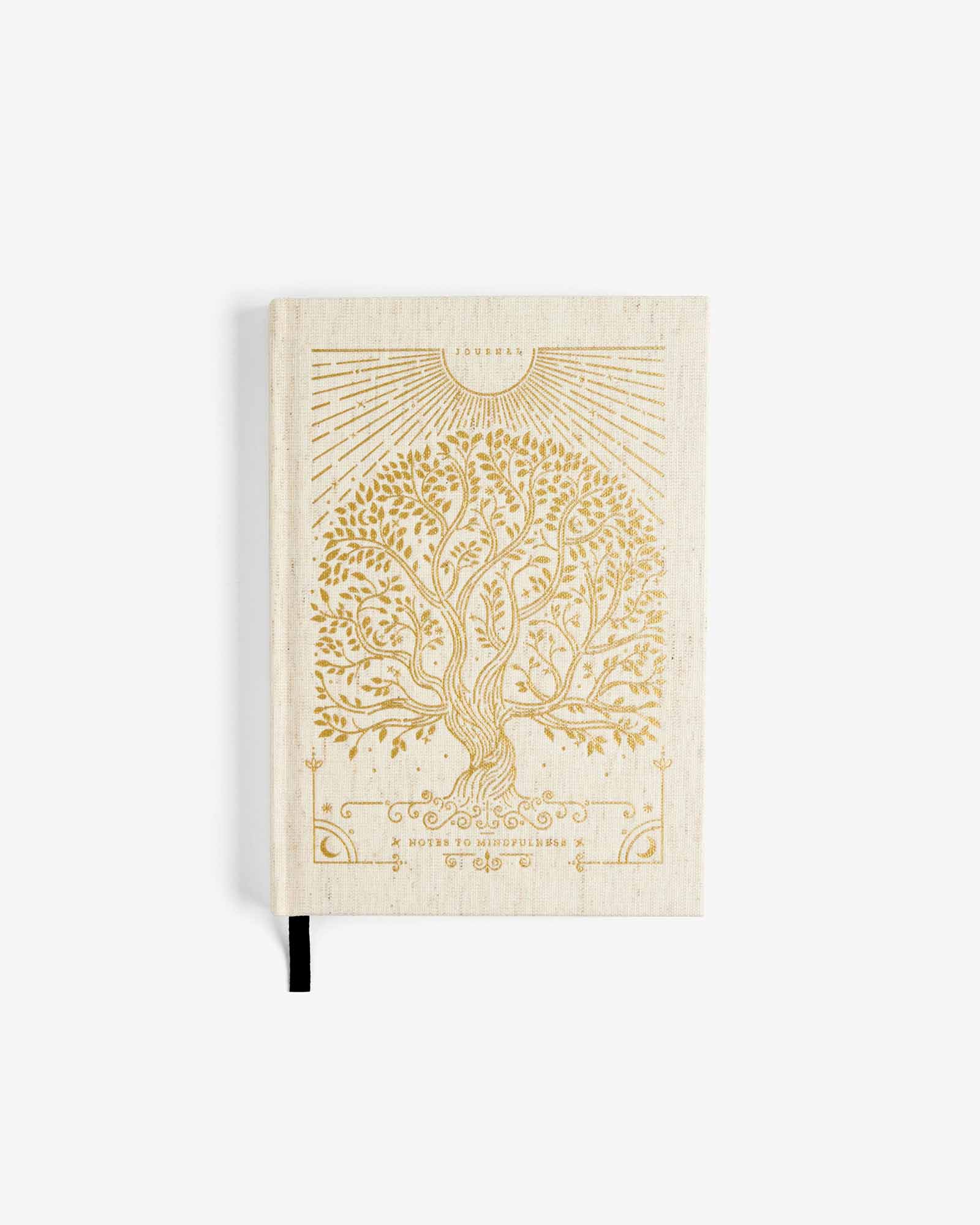 Beige notebook with embossed tree design on a white background