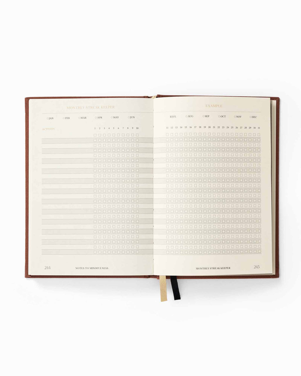 Open planner with monthly layout on a white background