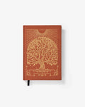 Brown notebook with gold tree design on a white background