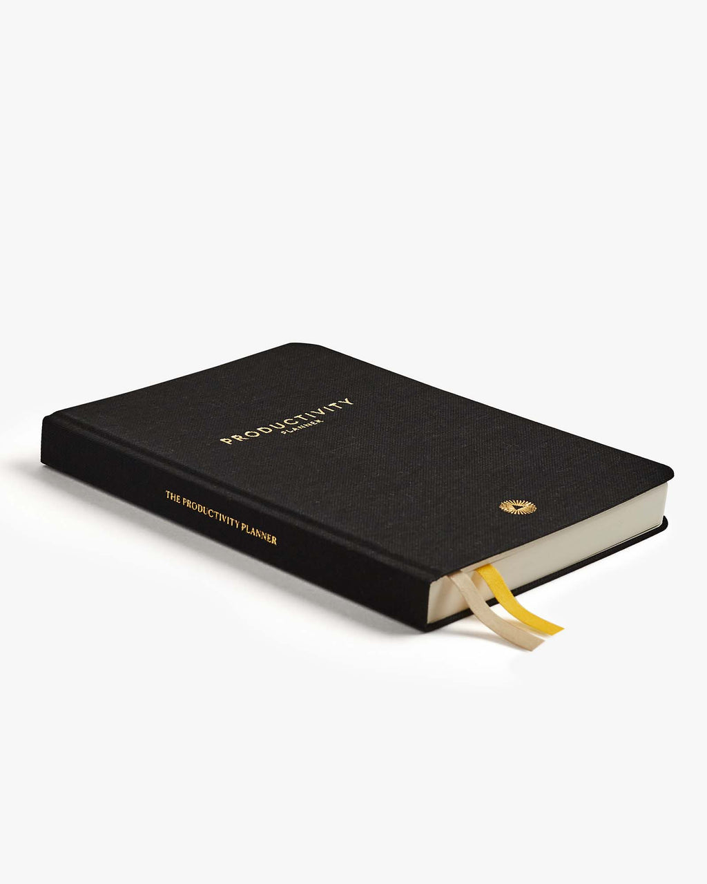Black planner with gold text on a white background