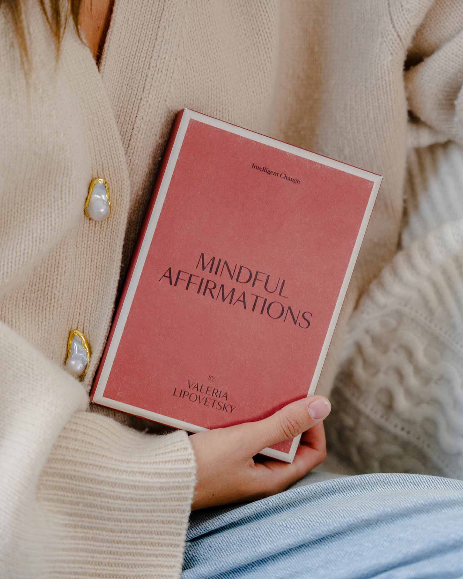 Person holding a book titled 'Mindful Affirmations' by Valeria Lipovetsky.