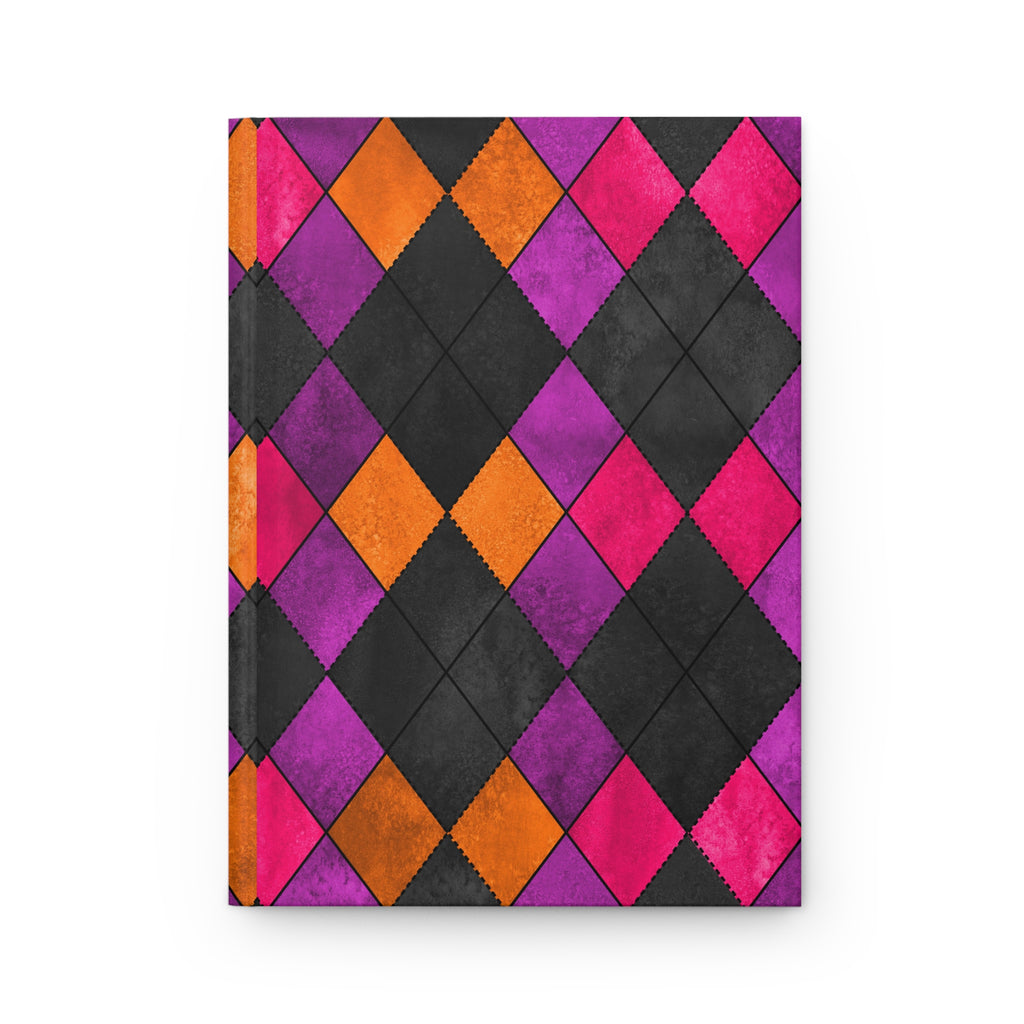 A hardcover notebook with a vibrant geometric harlequin pattern featuring alternating black, purple, orange, and hot pink diamonds, shown on a clean white background.