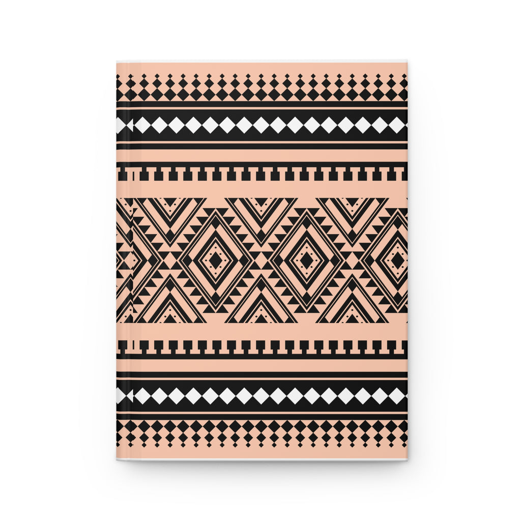 A notebook with a geometric tribal pattern in black and peach pink, shown on a clean white background.