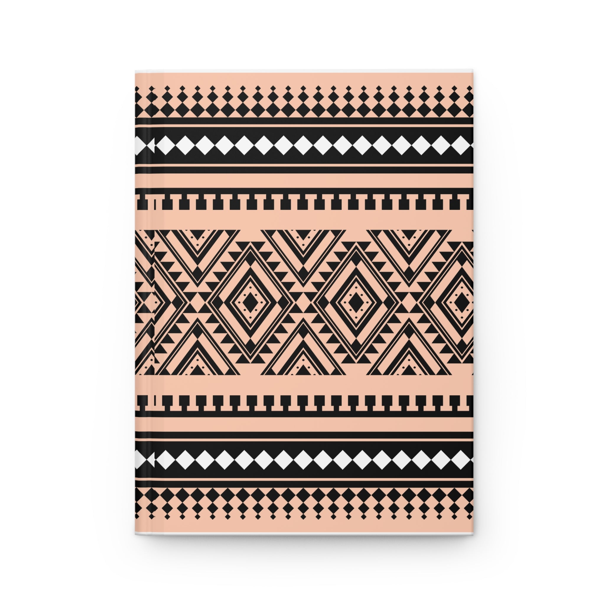 A notebook with a geometric tribal pattern in black and peach pink, shown on a clean white background.