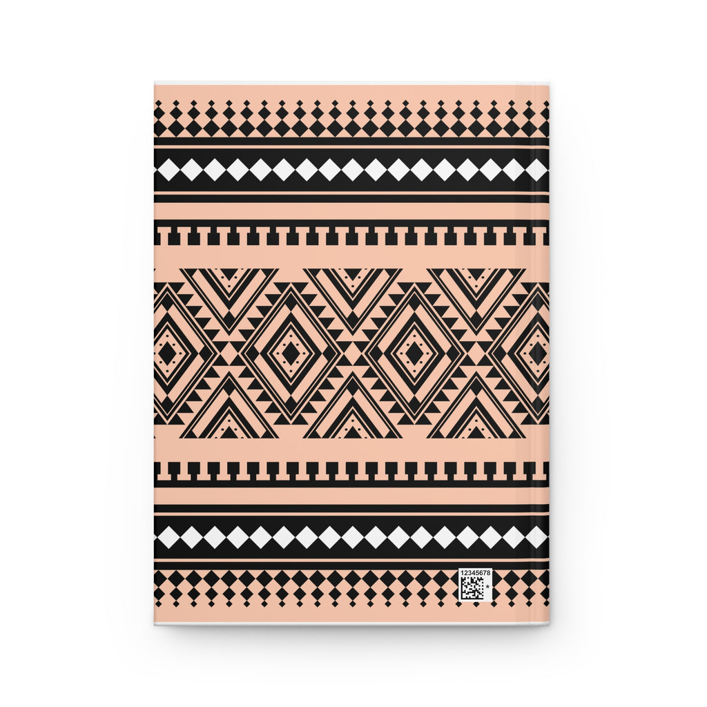 A notebook with a peach, black, and white geometric tribal pattern, shown flat against a white background.