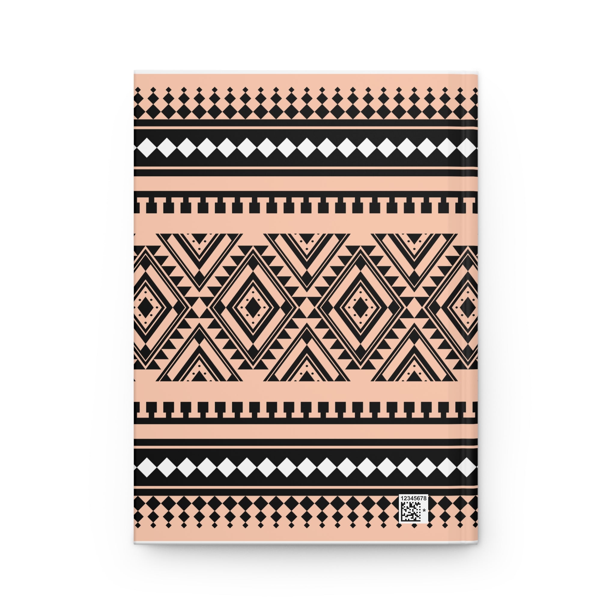 A notebook with a peach, black, and white geometric tribal pattern, shown flat against a white background.