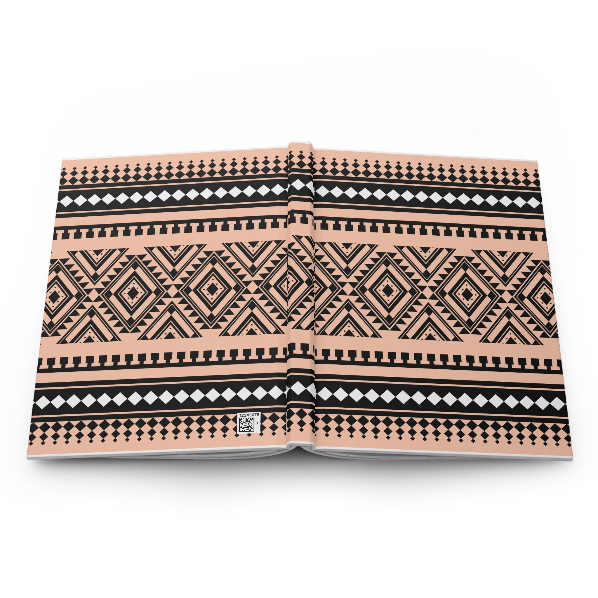 An open hardcover book showcasing a detailed geometric tribal pattern in black and white on a warm peach-beige background, photographed from directly above on a white background.