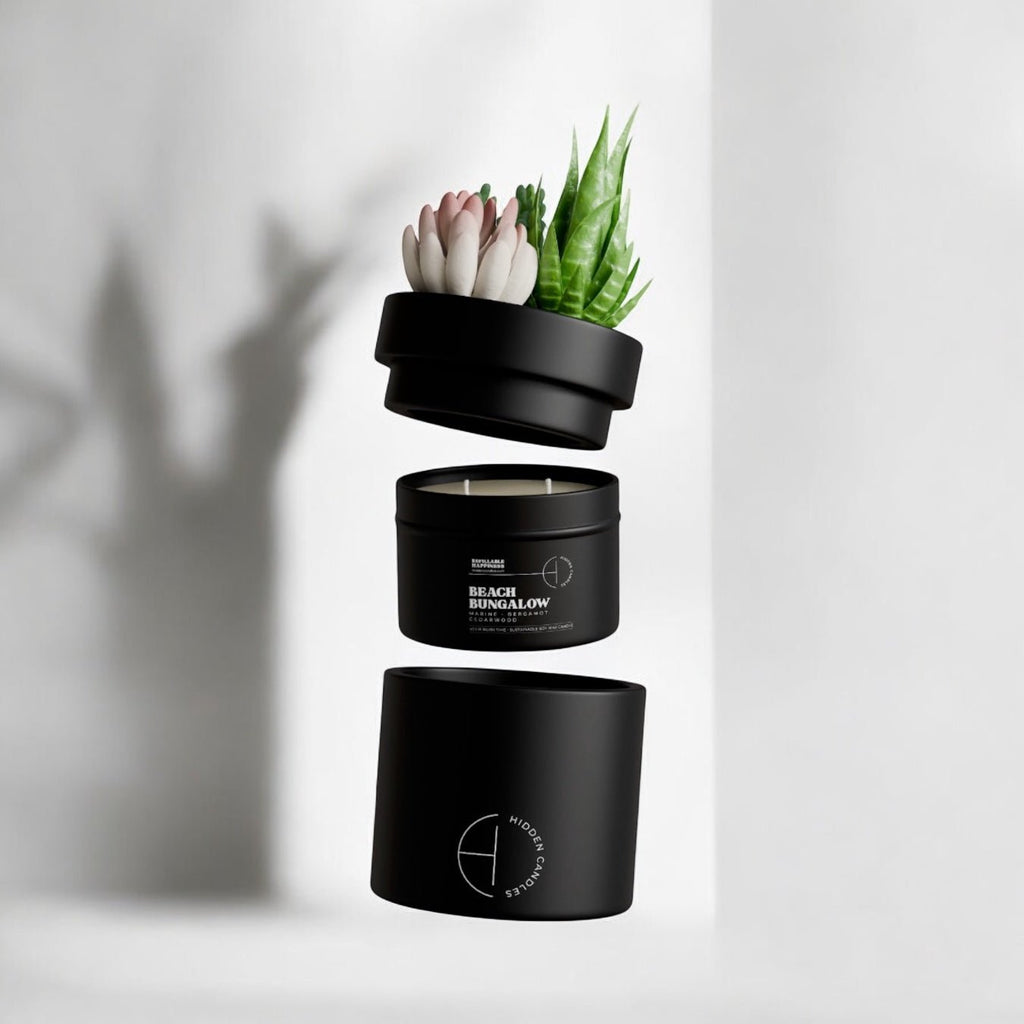 Black candle with plant design on a white background