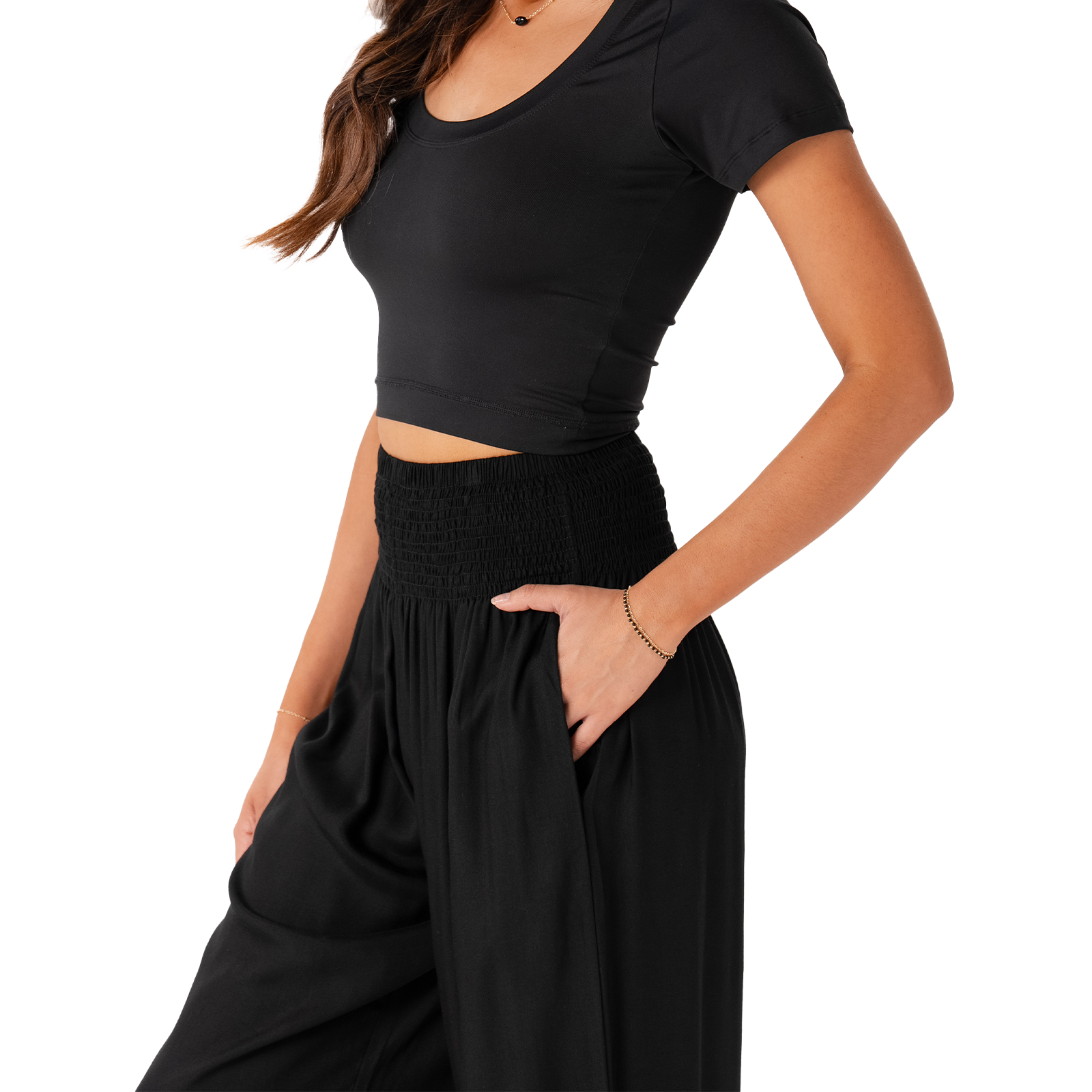 Person wearing a black outfit with a cutout design on a white background