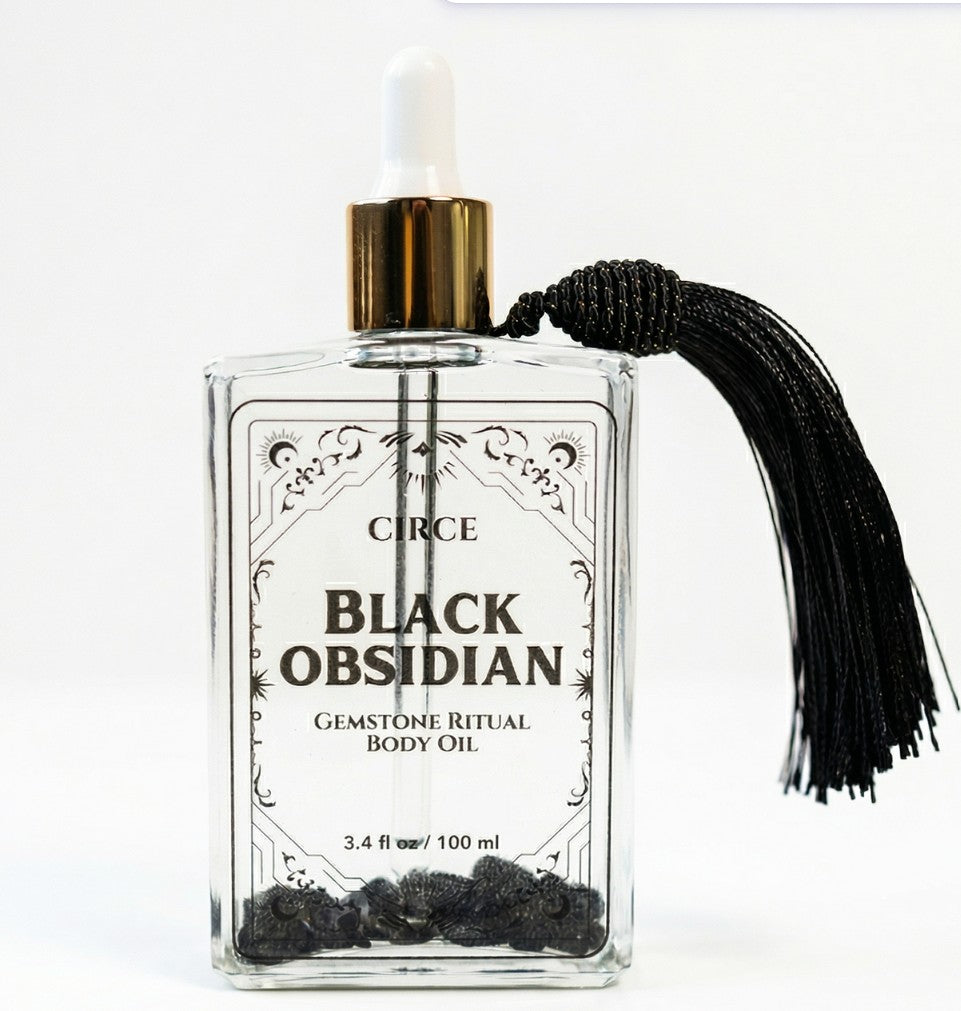Circe Black Obsidian gemstone ritual body oil bottle with black tassel on a white background