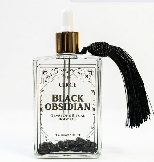 Circe Black Obsidian gemstone ritual body oil bottle with black tassel on a white background