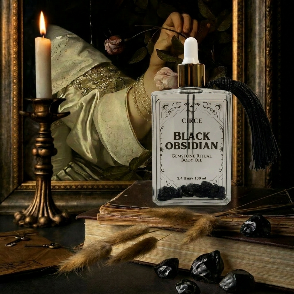 Body oil bottle labeled 'Black Obsidian' on a mystical setting with books, candles, and herbs.