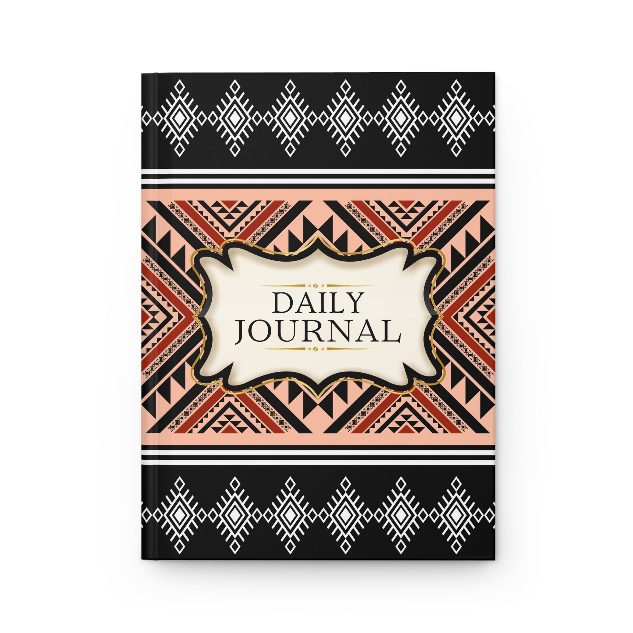 A hardcover daily journal with a geometric Southwestern-style pattern. The cover features black borders at the top and bottom with white diamond motifs, a central cream-colored label reading 'DAILY JOURNAL', and a middle band with orange, black, and beige geometric patterns.