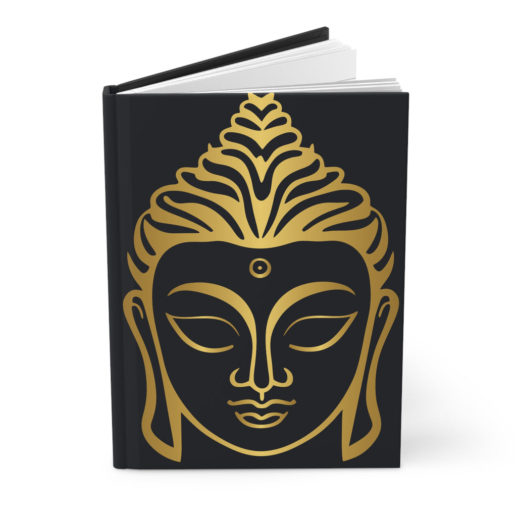 A hardcover notebook with a black cover featuring a large gold Buddha face design, shown standing upright on a white background.