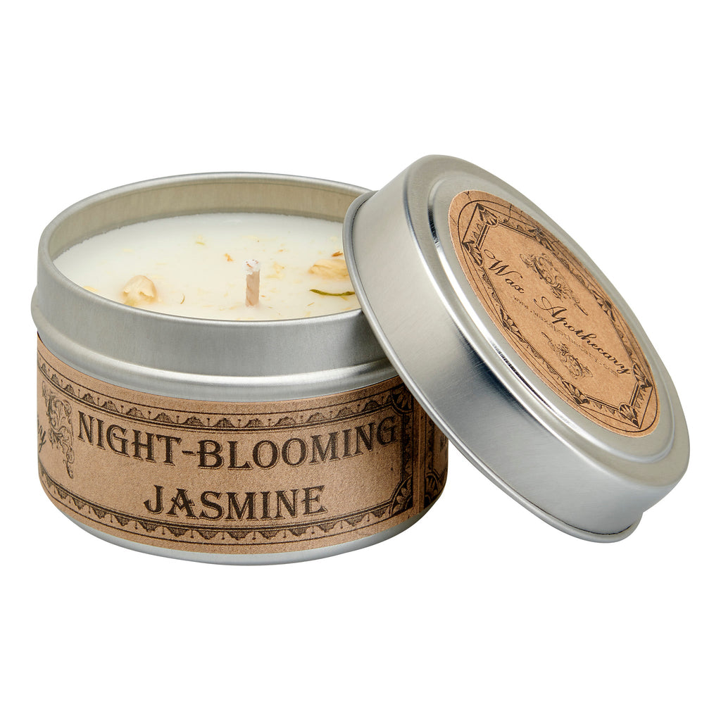 Candle in a tin labeled 'Night-Blooming Jasmine' with a decorative lid on a white background