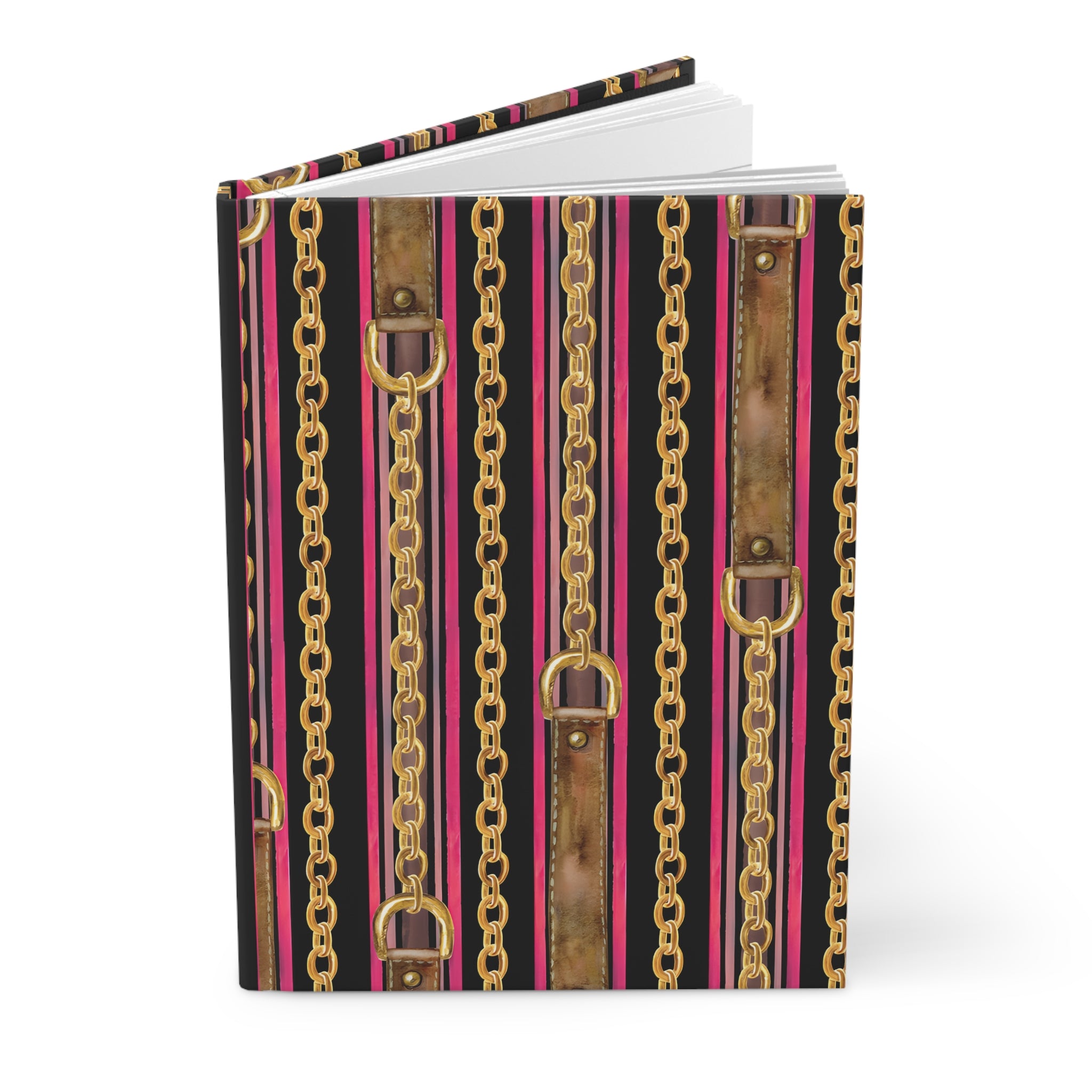 A hardcover notebook or journal standing upright, featuring a bold vertical pattern of gold chains, distressed brown leather straps, and bright pink stripes over a black background.