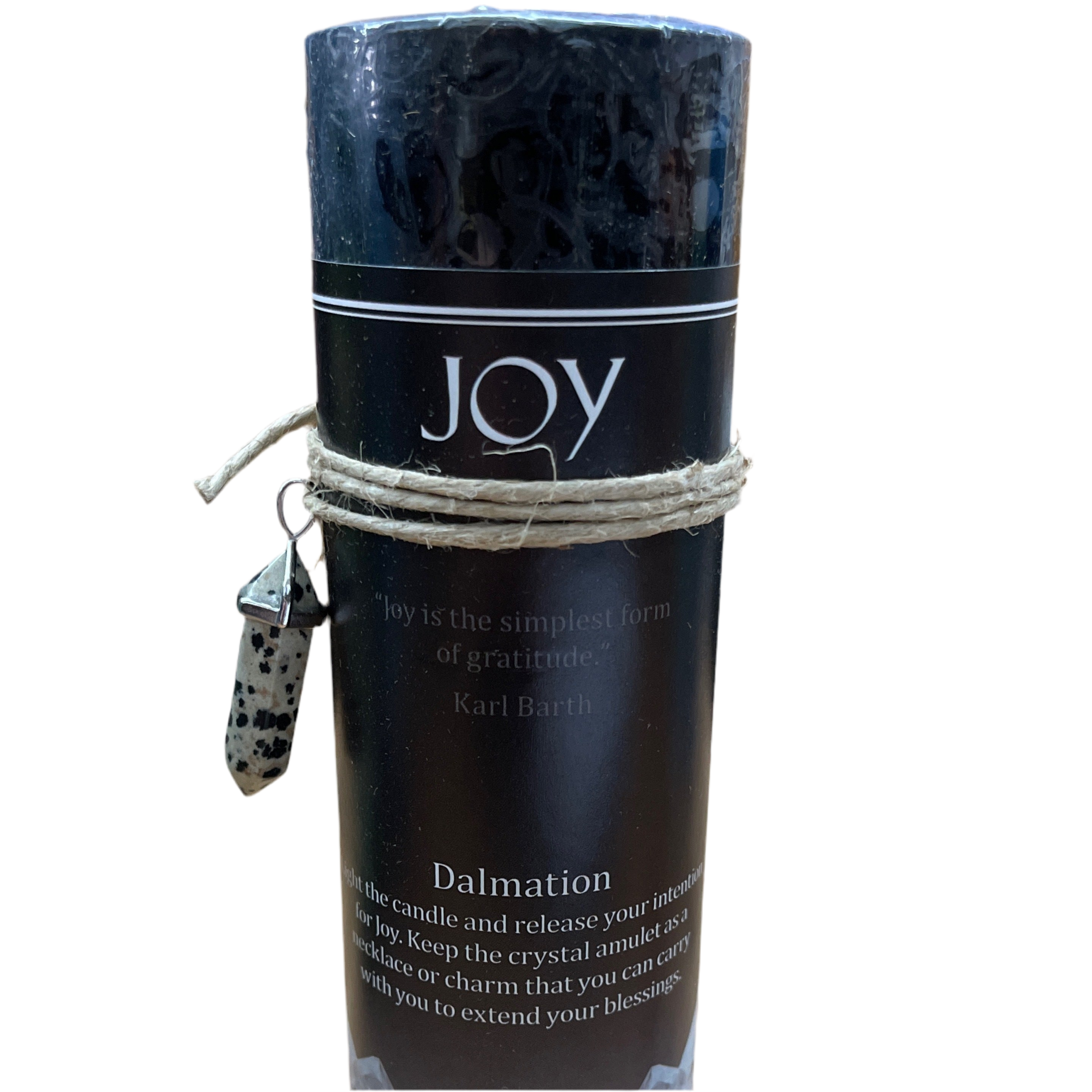 A black cylindrical candle wrapped in twine with a small hanging crystal charm, labeled 'JOY' and 'Dalmation', on a plain white background.