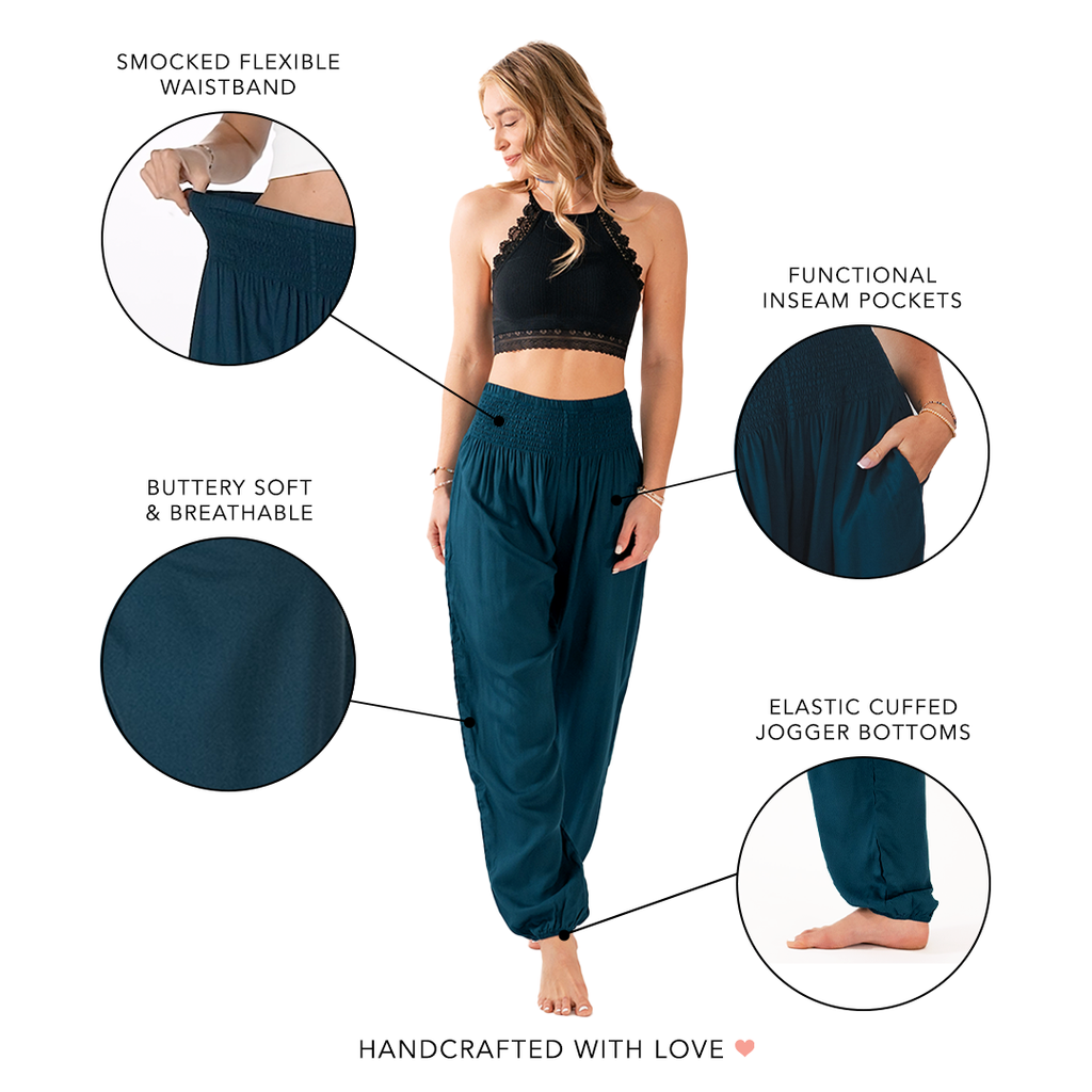 Woman wearing teal jogger pants with text highlighting features on a white background