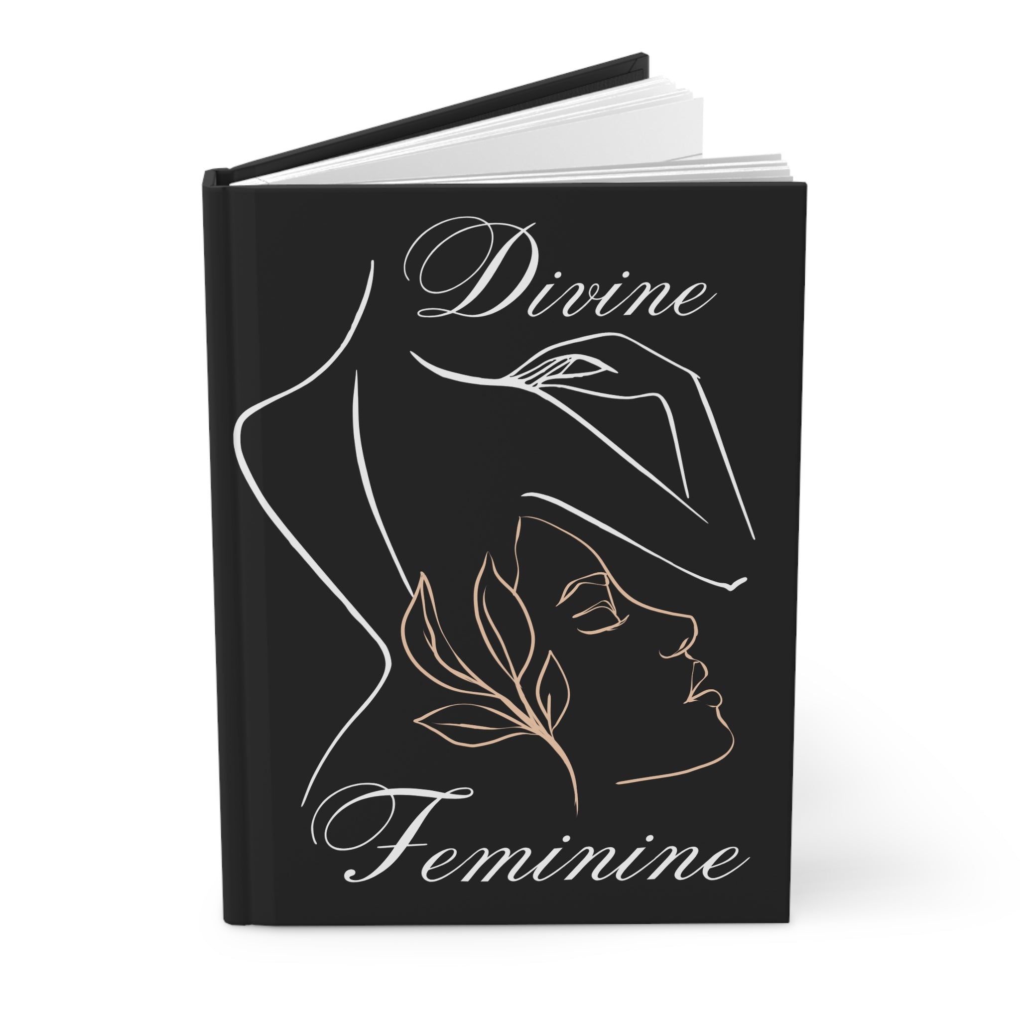 A hardcover journal with a black cover featuring a minimalist line art illustration of a woman in profile, with the words 'Divine Feminine' in white and rose gold script.