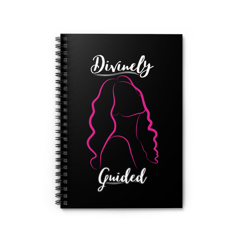 Black notebook with a pink silhouette of a woman and 'Divinely Guided' text on a white background