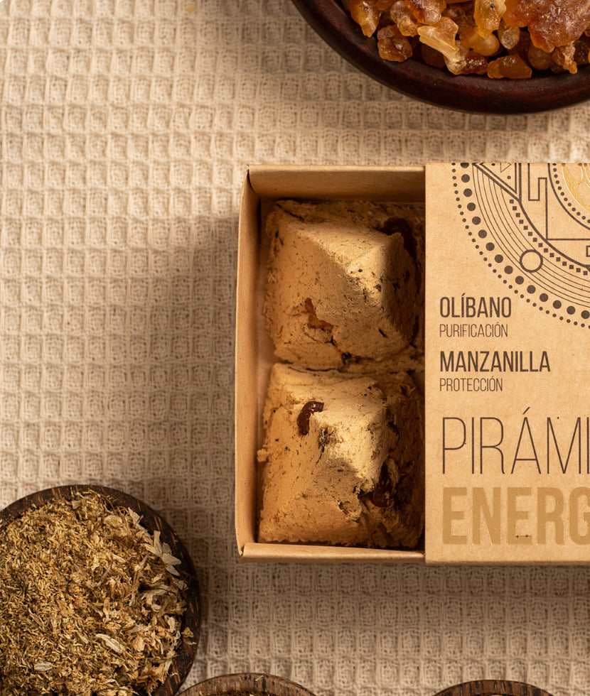 Box of tea bags with a pyramid design on a textured surface