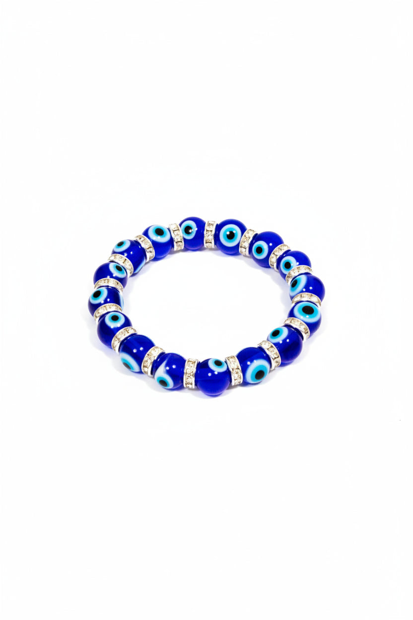 Blue beaded bracelet with eye designs on a white background
