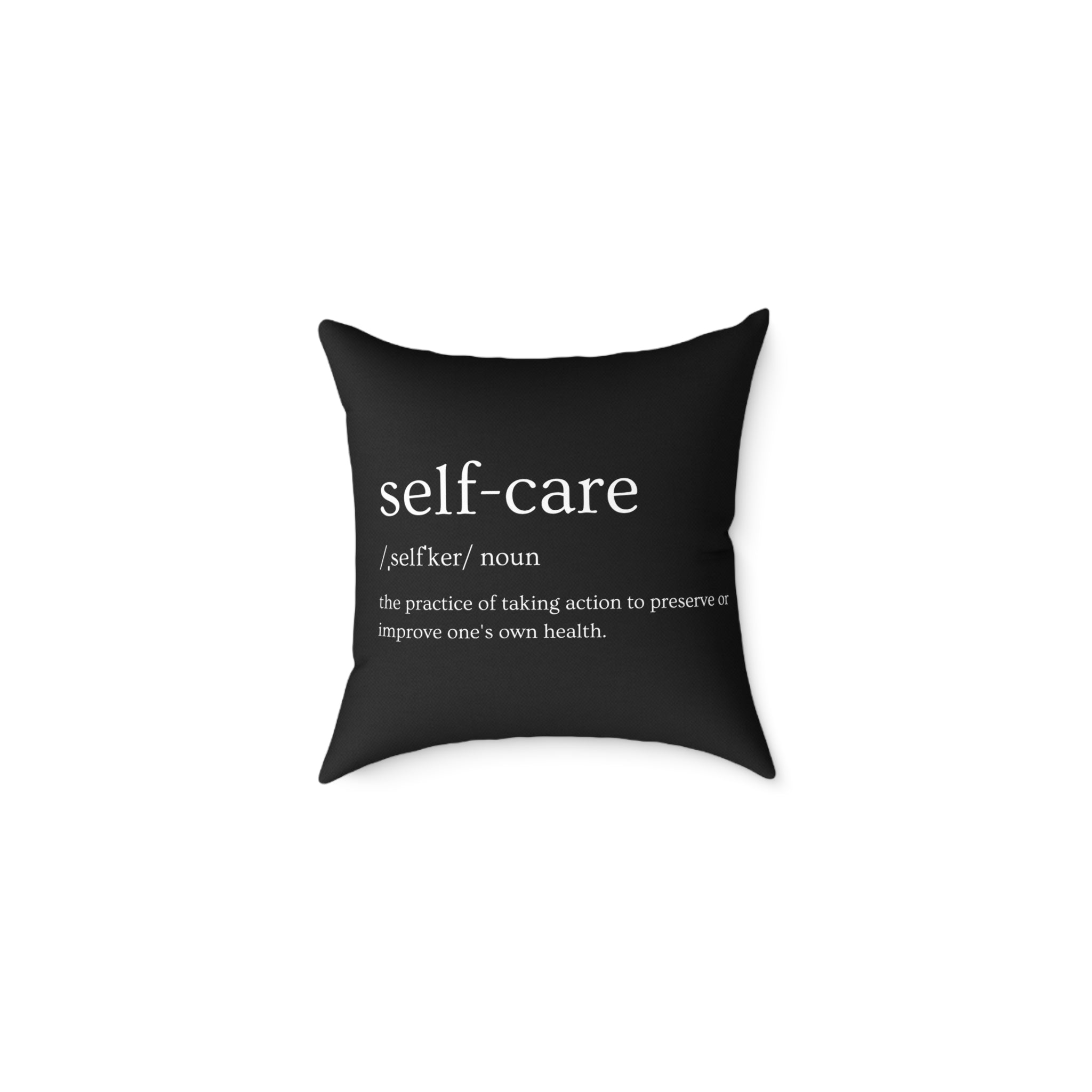 Black pillow with 'self-care' definition text on a white background