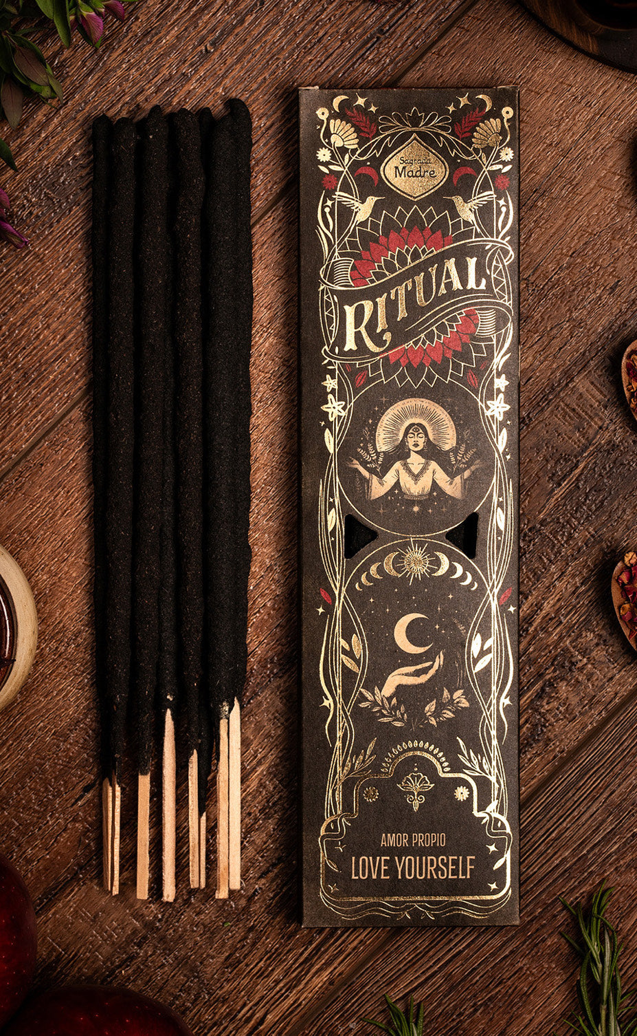 Incense sticks with decorative packaging on a wooden surface