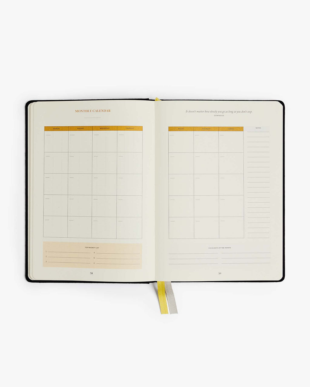 Open planner with grid and blank pages on a white background