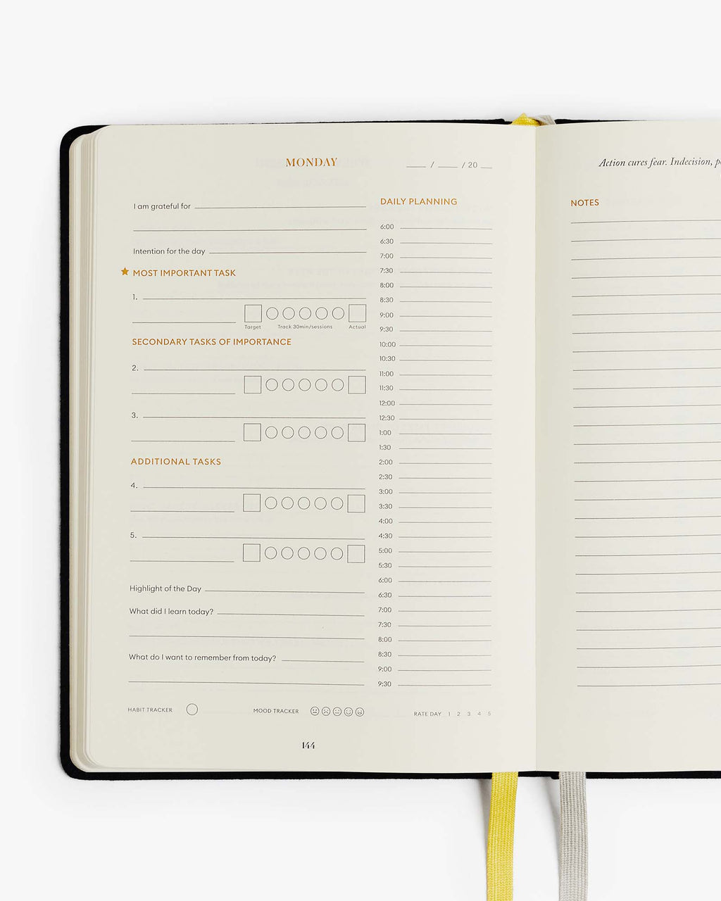 Open planner with daily schedule and notes on a white background