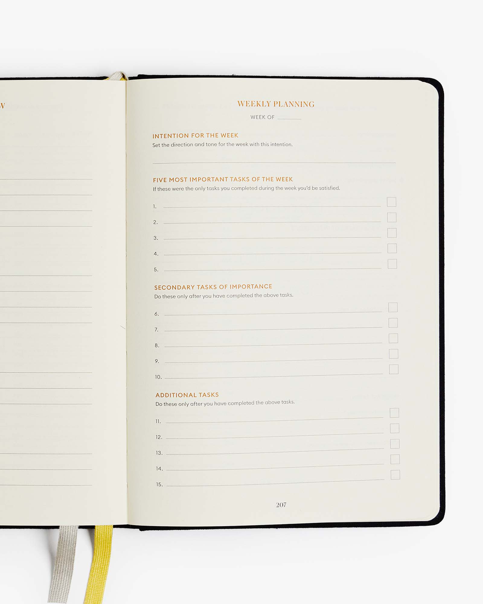 Open planner with weekly planning section on a white background