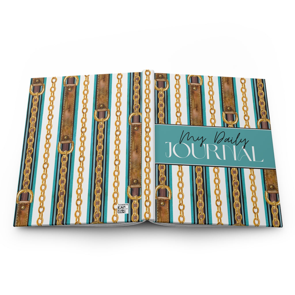 An open daily journal with a decorative cover pattern featuring vertical teal, white, and brown leather-look straps with gold chain links. A teal banner across the right page reads 'My Daily JOURNAL' in white script and serif text.
