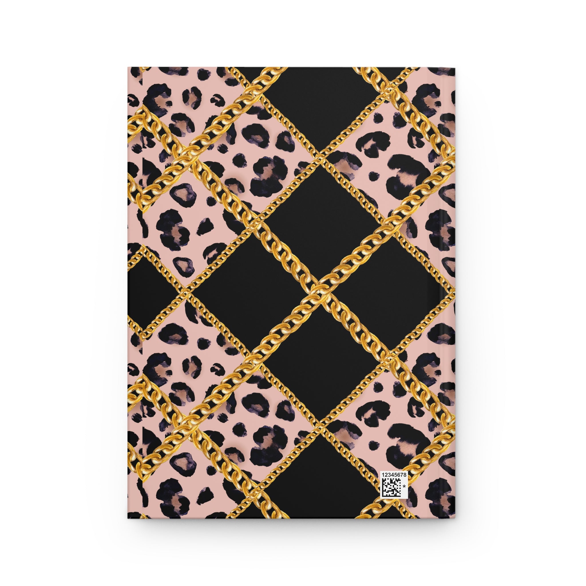 A notebook or journal with a bold patterned cover featuring black diamonds, pink leopard print sections, and metallic gold chain graphics, shown on a plain white background.