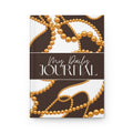 A hardcover daily journal with a brown and white design featuring gold beaded patterns and the text 'My Daily JOURNAL' on the front cover, shown on a plain white background.
