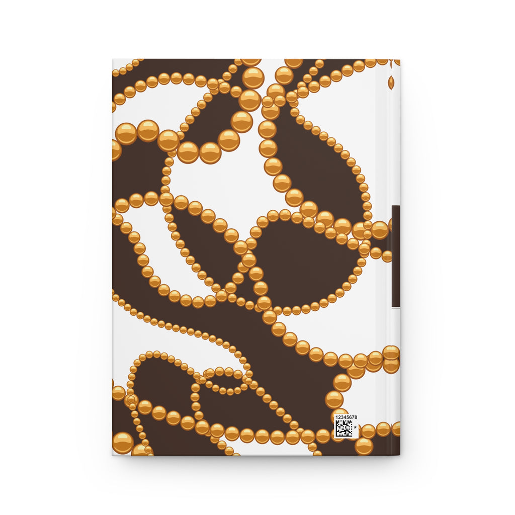 A notebook with a white cover decorated with a brown background and a pattern of gold beaded chains, shown on a plain white background.