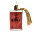 Love Potion Ritual Body Oil bottle with tassel on a white background