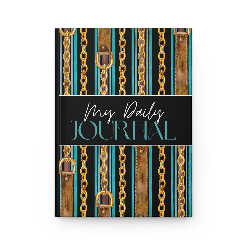 A hardcover daily journal with a decorative cover featuring vertical gold chains, brown leather straps, and turquoise stripes on a black background, with the text 'My Daily JOURNAL' across the center.