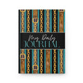 A hardcover daily journal with a decorative cover featuring vertical gold chains, brown leather straps, and turquoise stripes on a black background, with the text 'My Daily JOURNAL' across the center.