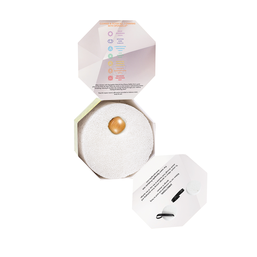 Cosmetic compact with a pearl-like object on a white background