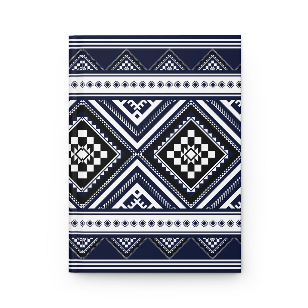 A rectangular notebook or journal with a geometric tribal pattern in navy blue, white, and black, shown against a plain white background.