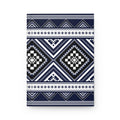 A rectangular notebook or journal with a geometric tribal pattern in navy blue, white, and black, shown against a plain white background.