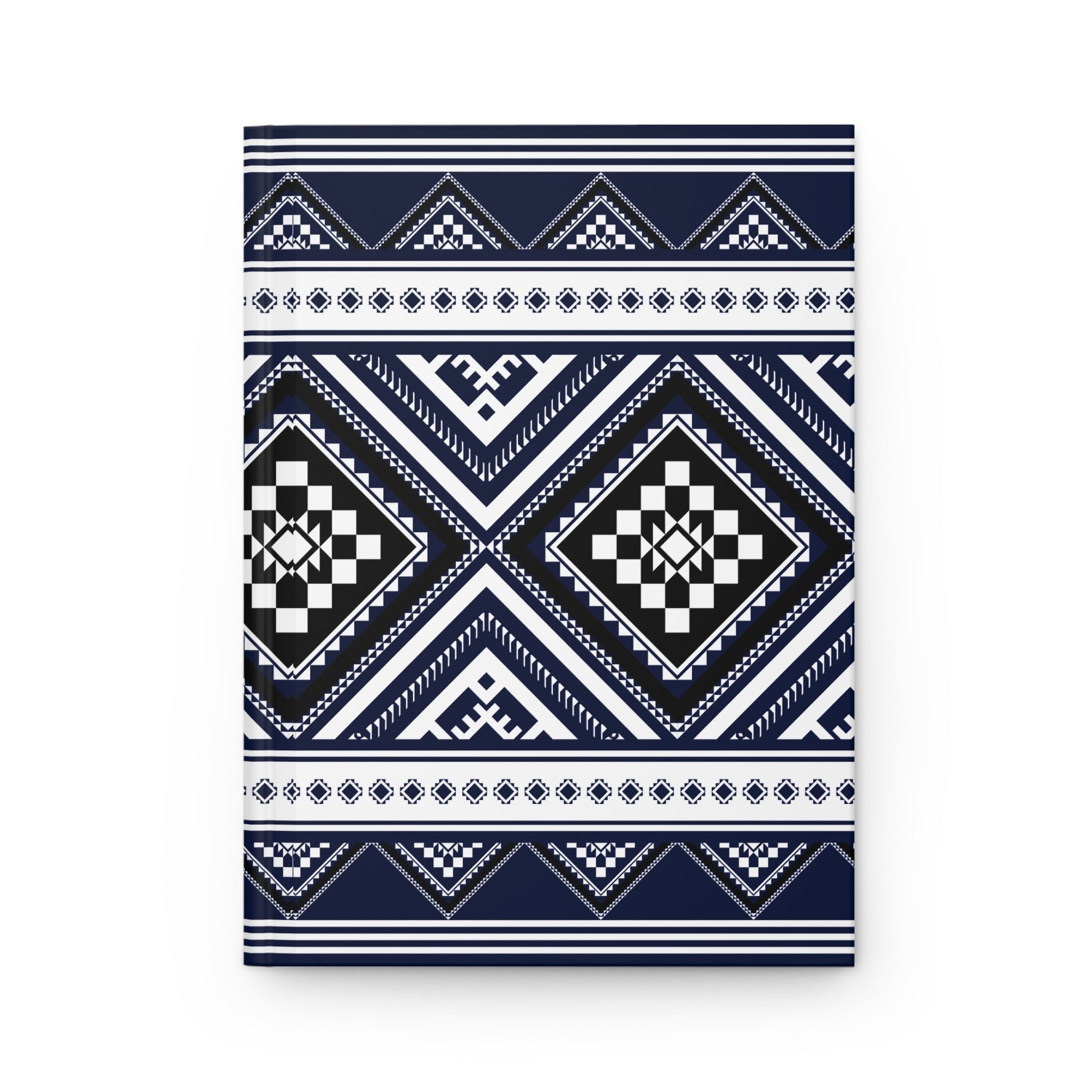 A rectangular notebook or journal with a geometric tribal pattern in navy blue, white, and black, shown against a plain white background.