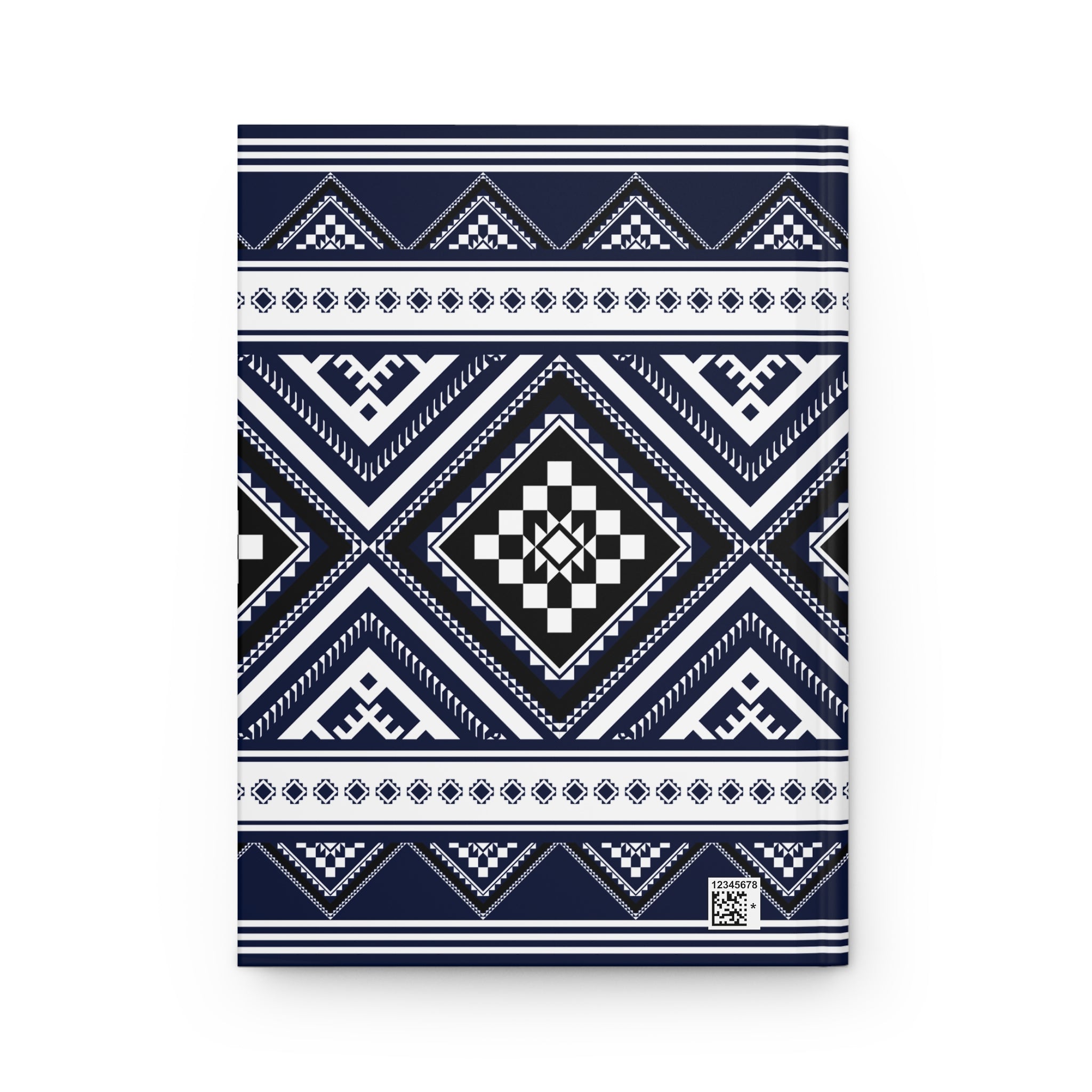 A notebook with a navy blue, white, and black geometric tribal pattern cover, shown flat against a white background.