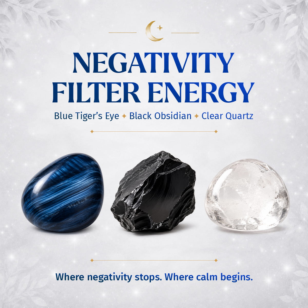 A promotional graphic for a 'Negativity Filter Energy' crystal set, featuring three stones: a polished blue tiger's eye, a raw black obsidian, and a clear quartz crystal, set against a light gray background with subtle snowflakes and gold text.