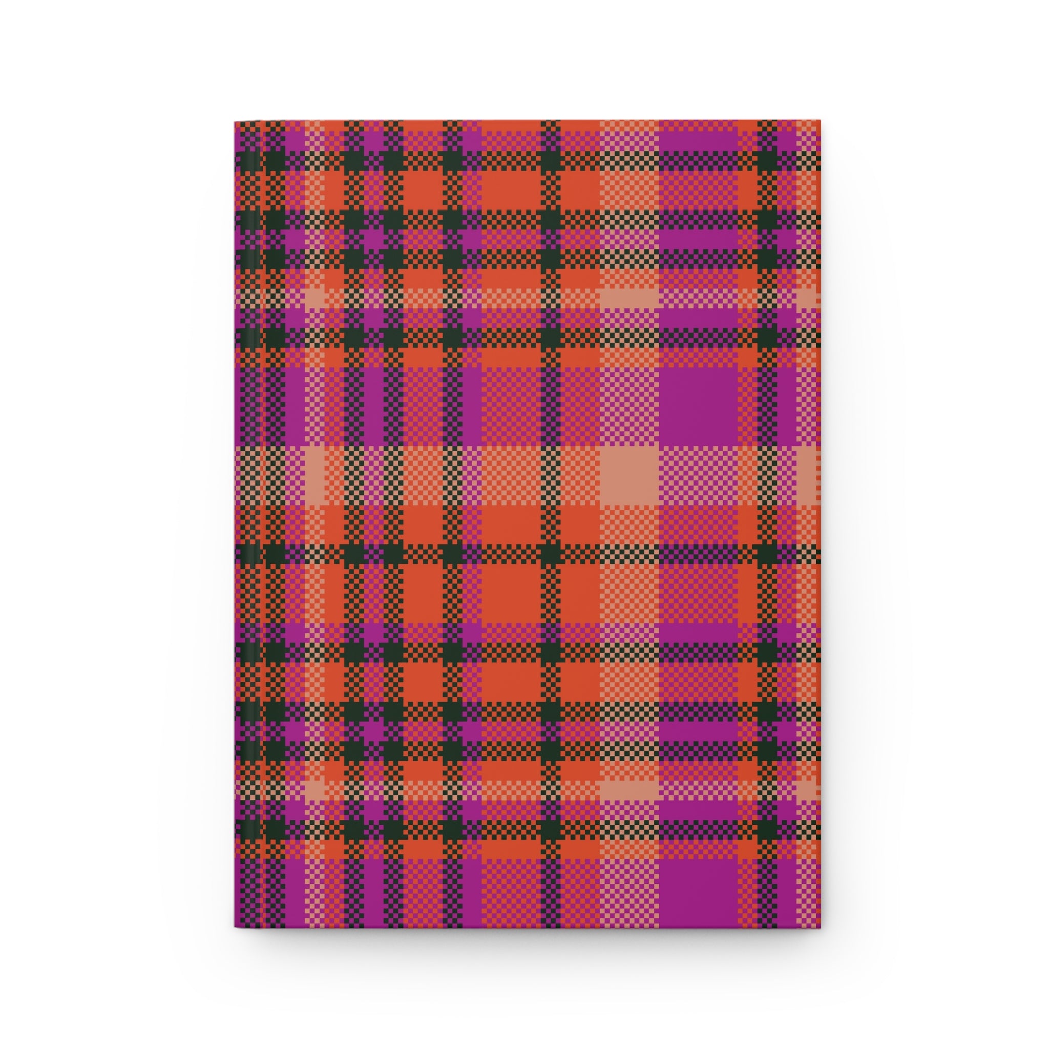 A notebook with a vibrant plaid cover pattern featuring magenta, orange, purple, and black stripes, shown against a plain white background.